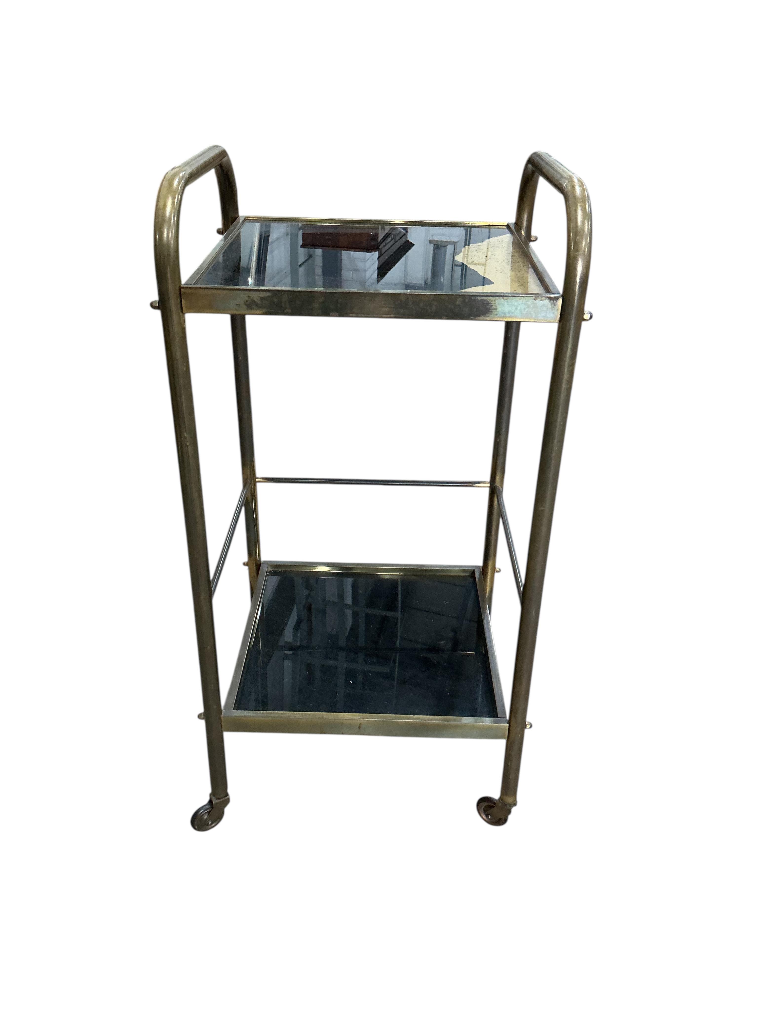 A mid century brass two tier trolley, width 32cm, depth 29cm, height 63cm